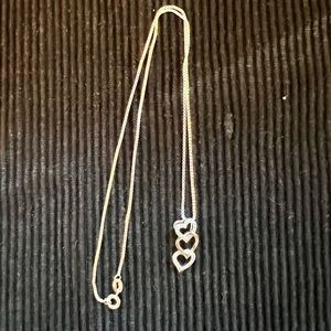 Necklace with triple heart pendant